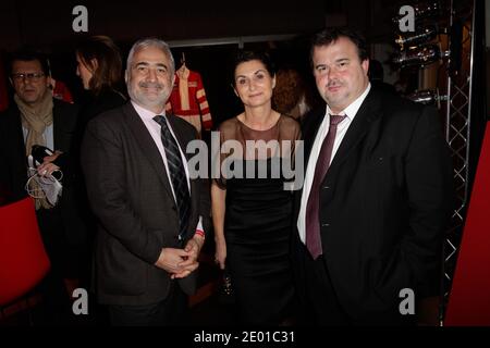 Guy Savoy, Pierre Herme e sua moglie partecipano alla festa del 'Grand Prix d'Amerique J-60' all'ippodromo di Vincennes, a Vincennes, Francia, il 26 novembre 2013. Foto Jerome Domine/ABACAPRESS.COM Foto Stock