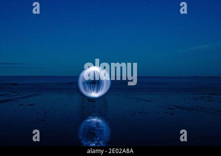 Orb dipinto di luce su Wells Beach Maine Foto Stock