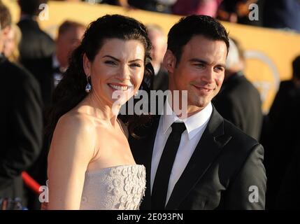 Julianna Margulies, a sinistra, e Keith Lieberthal partecipando al 18° Premio annuale attori della Gilda (SAG) tenutosi presso il Shrine Auditorium di Los Angeles, CA il 29 gennaio 2012. Foto di Lionel Hahn/ABACAPRESS.COM Foto Stock