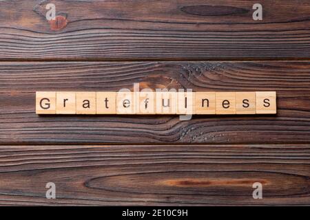 parola di gratitudine scritta su blocco di legno. testo di gratitudine su tabella di cemento per il vostro desing, concetto. Foto Stock