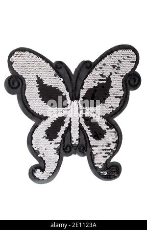 Patch farfalla nera e argentata con sequina isolata su sfondo bianco Foto Stock