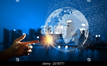 Business globale e concetto di connessione di rete. Uomo d'affari che guida la connessione globale con Building background. Elementi arredati dalla NASA. Foto Stock