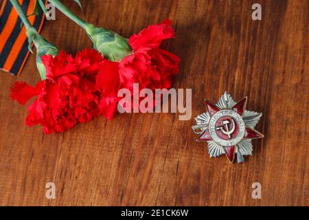 Ordine della Guerra Patriottica di San e due fiore rosso e George ribbon Foto Stock