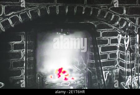 una telecamera a infrarossi che mostra un incendio di carbone che si brucia un focolare domestico Foto Stock