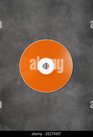 CD arancione - modello di mockup di etichette DVD isolato su cemento sfondo Foto Stock