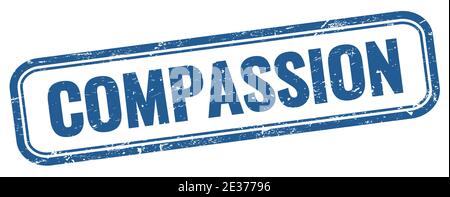 Testo COMPASSIONE su un francobollo rettangolare vintage blu. Foto Stock