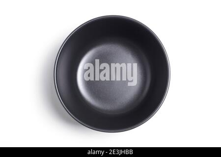 Black clay bowl isolated on white background. View from above Foto Stock