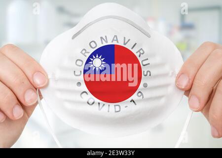 Maschera respiratore con bandiera di Taiwan - epidemia di Coronavirus COVID-19 concetto Foto Stock