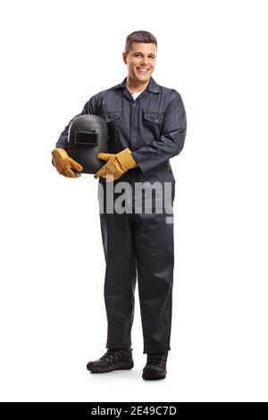 Ritratto a lunghezza intera di un saldatore in una tenuta uniforme un casco protettivo e sorridente alla telecamera isolata su bianco sfondo Foto Stock