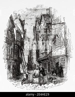 Una strada nella vecchia Londra. Vecchia illustrazione per i tempi difficili. Charles Dickens Foto Stock