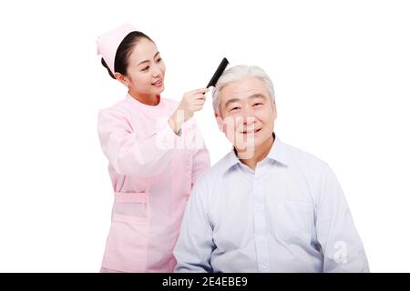 Infermieri femminili per aiutare i pazienti capelli foto di alta qualità Foto Stock