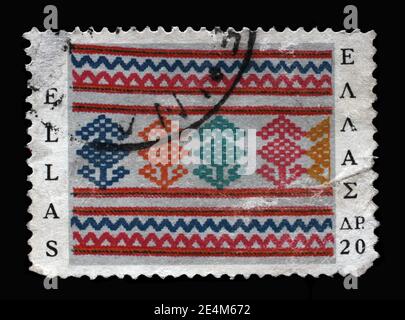 Il francobollo stampato in Grecia mostra tessuto tessuto a mano, Arte popolare greca, circa 1966 Foto Stock