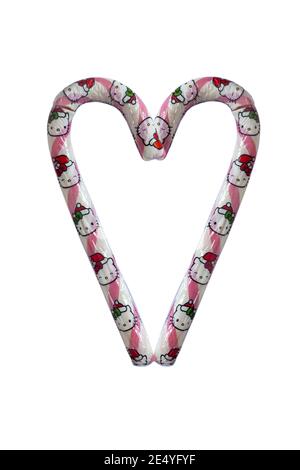 Ciao Kitty Giant Candy cane fragola sapore isolato su bianco sfondo - 2 canne caramelle disposte a forma di cuore Foto Stock