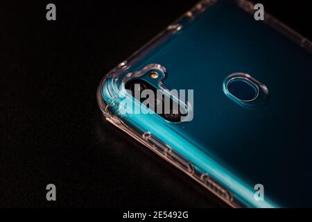 Selective focus on back of new smartphone Samsung Galaxy M11 triple camera and fingerprint sensor. Bucharest, Romania, 2021 Foto Stock