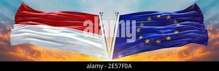 Bandiera dell'Unione europea e bandiera di Monaco che svanono con il cielo di tessitura Bandiera doppia nuvola e tramonto Foto Stock
