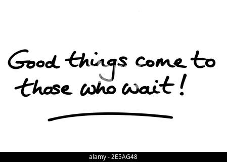 Le cose buone vengono a coloro che aspettano! scritto a mano su sfondo bianco. Foto Stock