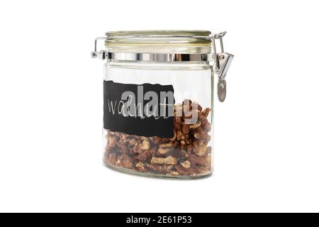 Noci in vasi di vetro, chiusura a scatto, isolate su bianco Foto Stock