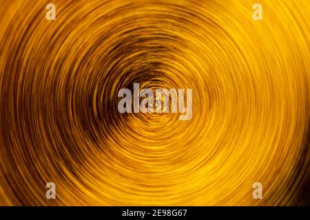 Sfocatura radiale sfondo astratto dorato per scopi di progettazione Foto Stock
