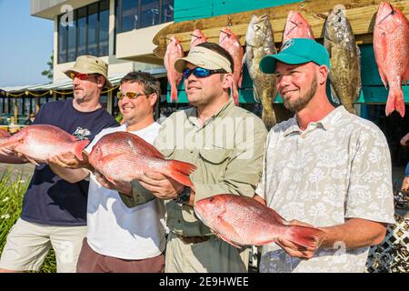 Alabama Orange Beach Zeke's Landing Red Snapper Tournament, Fish holding Fishing men team winners Winning, Foto Stock