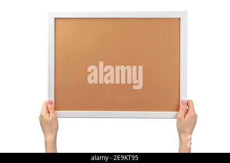 Le mani femminili tengono la cornice fotografica isolata su bianco Foto Stock