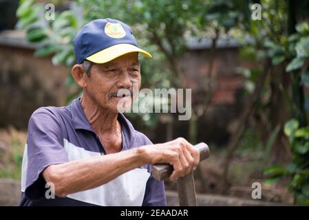 Vietnamita in canoa, delta del Mekong, Vietnam Foto Stock