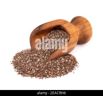 Semi di Chia in paletta di legno, isolati su sfondo bianco. Supercibo sano. Semi organici di chia. Foto Stock