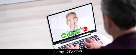 Videochiamata in conferenza con il medico Foto Stock