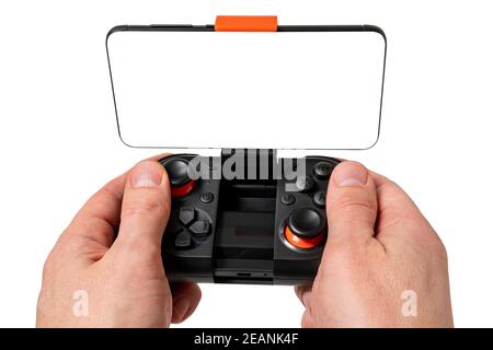Game Pad con smartphone a mani isolate su sfondo bianco. Concetto di gioco mobile. Foto Stock