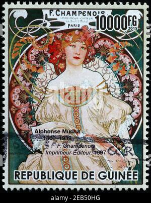 Illustrazione pubblicitaria di Alphonse Mucha su francobollo Foto Stock