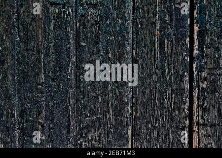 Struttura di legno scuro afflitto. Grunge tavole di legno per porte in legno afflitto. Vecchio sfondo di legno. Foto Stock