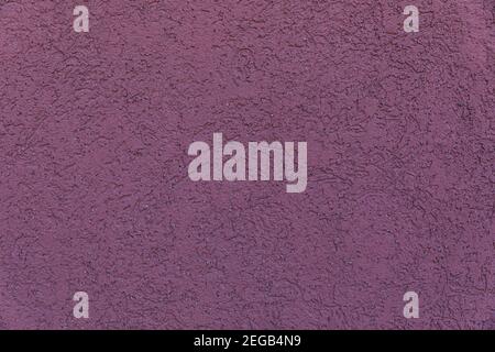 La struttura della parete è di colore malva scuro Foto Stock