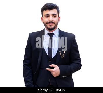 Giovane ragazzo allegro che indossa il tuxedo con alta sicurezza e pronto per il prossimo Foto Stock