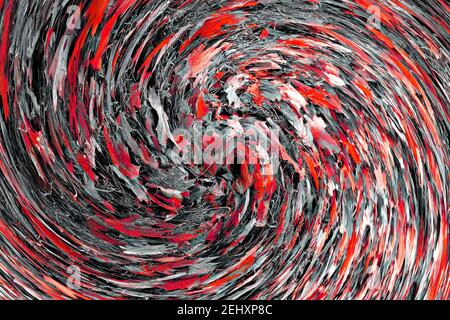 Riassunto: Vortice o spirale di foglie d'autunno tinte rosse che giacciono su erbe grigie Foto Stock