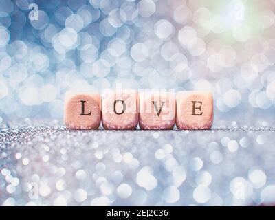 Scritta Amore brillante glitter luci bokeh sfondo . Foto Stock