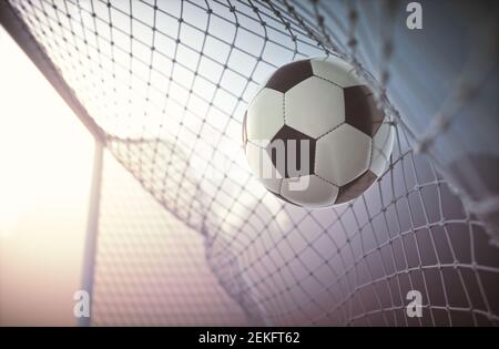 Pallone da calcio, segnando l'obiettivo e muovendo la rete. Foto Stock