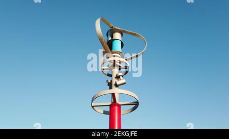 Turbina eolica ad asse verticale che genera energia elettrica mentre gira contro cielo blu Foto Stock