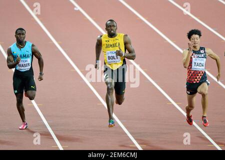 Usain Bolt (Giamaica), Warren Fraser (Bahamas), Shuhei Tada (Giappone). 100 metri uomini, serie di riscaldatori. IAAF Athletics World Championships - Londra 2017 Foto Stock