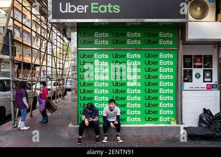 Piattaforma americana online per l'ordinazione e la consegna di cibo lanciata da Uber, Uber mangia segno, visto a Hong Kong. Foto Stock