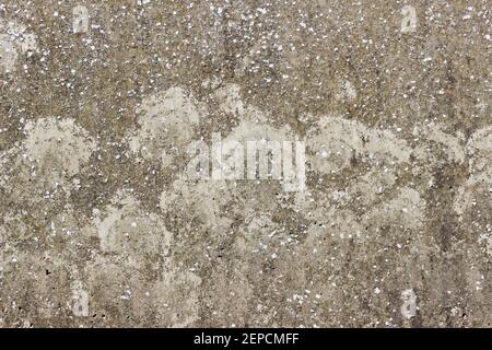 Una superficie piana di calcestruzzo ruvida e resistente agli agenti atmosferici Foto Stock