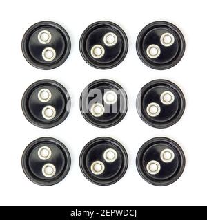 Set di nove grandi bottoni neri per cucire tagliati e. isolato su sfondo bianco quadrato Foto Stock