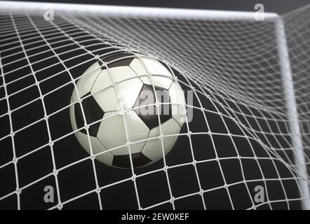 Pallone da calcio, segnando l'obiettivo e muovendo la rete. Illustrazione 3D, su sfondo scuro. Foto Stock