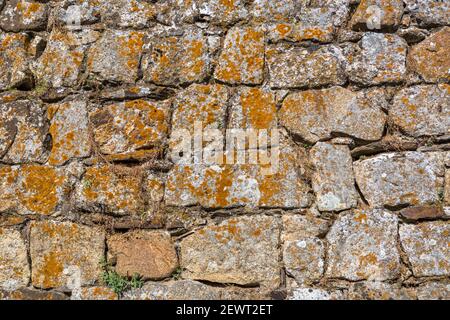 Architetture texture, dettagliate e rustiche di pareti in granito in muratura accoppiato... Foto Stock