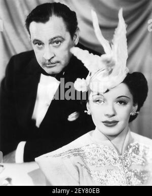 JOHN BARRYMORE e la sua quarta moglie ELAINE BARRIE Pubblicità Ritratto Per LA MEZZANOTTE 1939 il regista MITCHELL LEISEN sceneggiatura Charles Brackett Billy Wilder Miss Colbert's Downs di Irene Paramount Pictures Foto Stock