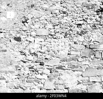 Italia e mattoni a scalino fessurati in vecchio materiale di tessitura della parete lo sfondo Foto Stock