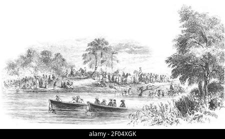 Pellegrini che fanno il bagno in Giordania. Foto Stock