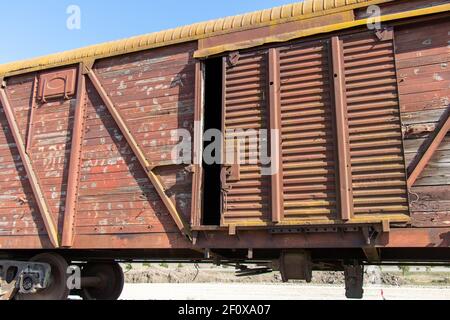 Sfondo industriale d'epoca con dettagli di vagoni per il trasporto merci di vecchio stile. Concetto di trasporto. Foto Stock