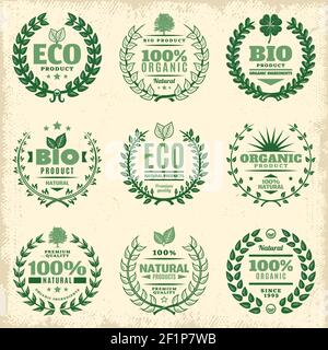 Etichette ecologiche vintage verdi con iscrizioni e decorazioni wreathes floreali naturali isolato illustrazione vettoriale Illustrazione Vettoriale