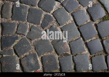 Texture pavimentazione pietra curva primo piano Foto Stock