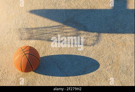 palla da basket su pavimento in cemento con l'ombra del gol accanto ad esso. rendering 3d Foto Stock