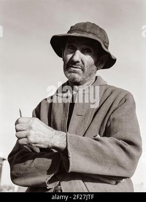 Firebaugh, California. Proveniva da Webber Falls, Oklahoma, con due figli nel 1938. Raccoglitrici di cotone. Febbraio 1939. Fotografia di Dorothea Lange Foto Stock